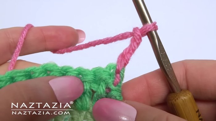 In the next stitch, make two double crochet stitches all in the same space (forming a ring).