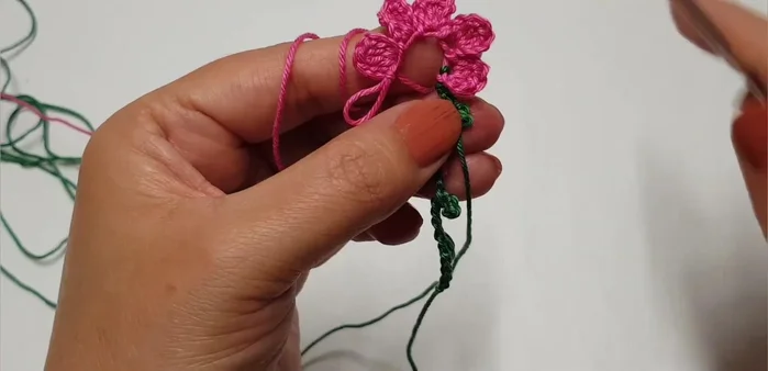 Join all petals by passing the yarn through the first row to create a complete flower.