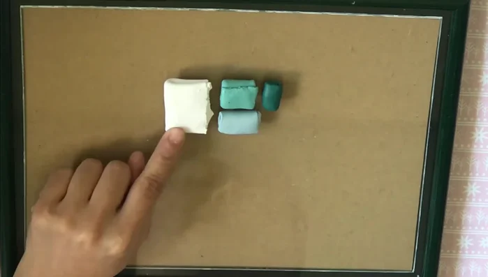 Prepare molds: Dust snowflake and Christmas tree molds generously with white mica powder for a shimmer effect (or cornstarch for a matte finish).