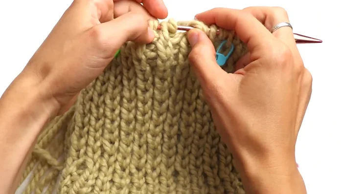 Place stitch markers every 12 stitches (or 10 if you cast on 40 stitches) around the hat.