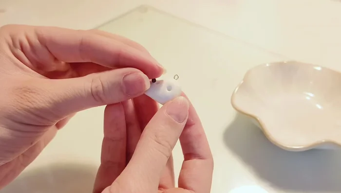 Add details to the charm (eyes, mouth, blush, etc.).