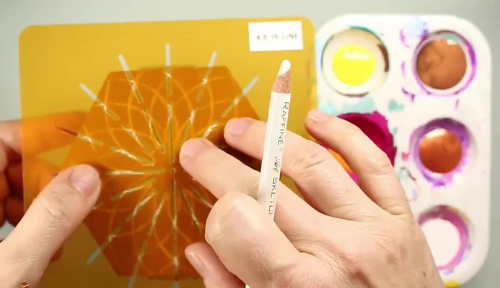 Create a small mandala using a seed of life pattern in the center with a divider stencil.