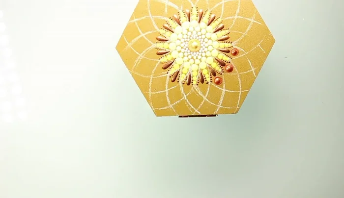 Add bronze dots with the largest stylus tool at the end of the pointed petals.