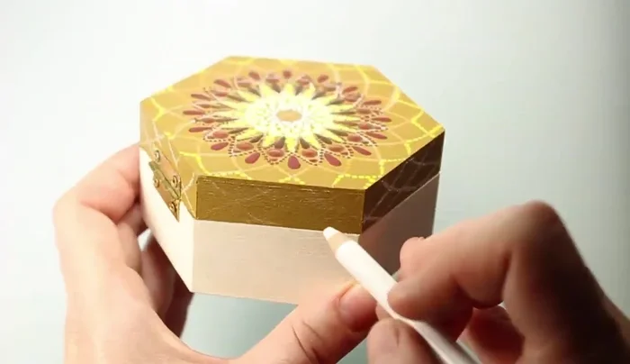 Add orange dots using a dotting rod that fits in the space between existing shapes.