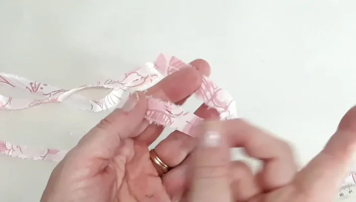 Continue interlinking and winding fabric into a ball (fist or double fist size).