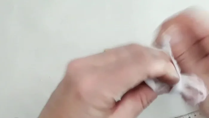 Continue interlinking and winding fabric into a ball (fist or double fist size).