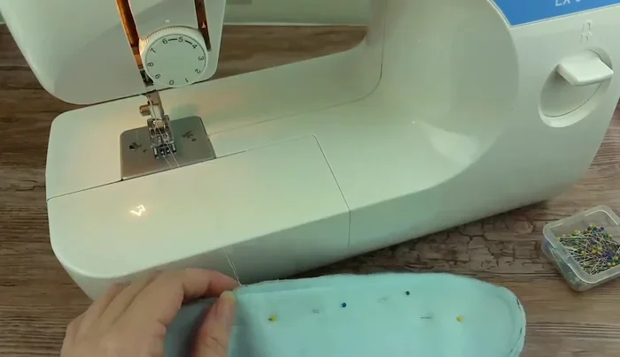 Turn the mitten right side out.