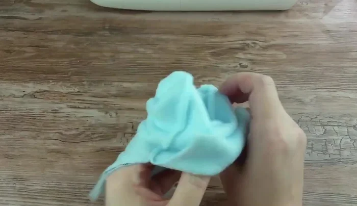 Turn the mitten right side out.