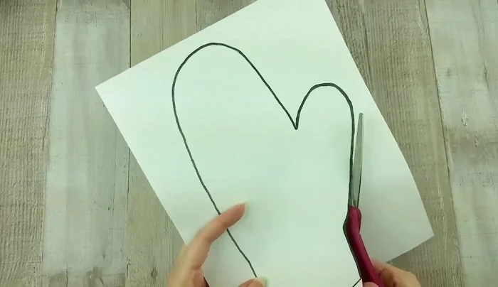 Cut out both layers of fabric along the traced line, ensuring they remain together.