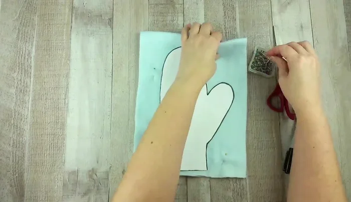 Cut out both layers of fabric along the traced line, ensuring they remain together.