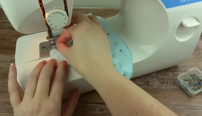 Turn the mitten right side out.