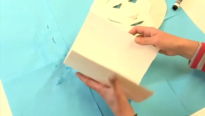 Fold a piece of paper in half.