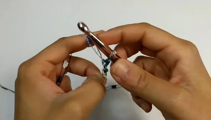 Fasten off, leaving a 10-inch tail. Repeat this process four more times to create five 18-inch chains.