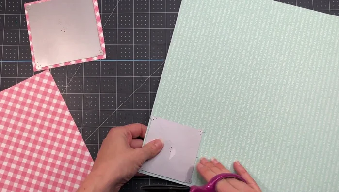 Cut patterned paper to fit the die sizes.