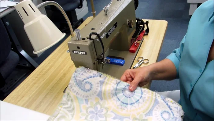 Sew the pillow cover: Sew around three sides of the pillow cover, using a cording foot or zipper foot to get close to the cording.