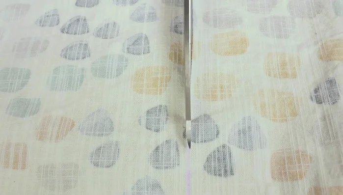 Cut out two 4 by 1.5 inch strips of fabric.