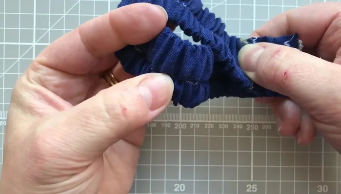 Join the ends of the strap with a straight stitch and trim excess fabric. Secure the raw edges of the strap to prevent fraying