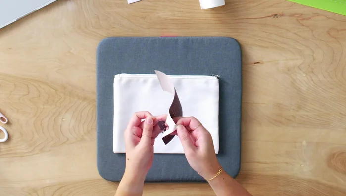 Weed the excess Infusible Ink material from the liner.