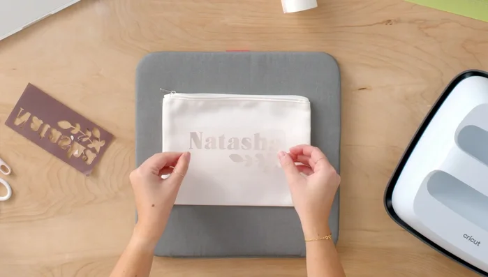 Apply heat using the Cricut EasyPress 3 with settings from the Cricut Heat app.