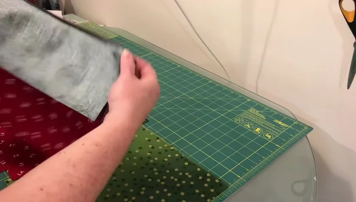 Sew main fabric: Sew the side and bottom seams of the main fabric pieces with a 1/4" seam allowance. Square off the corners by opening them up, aligning seams in opposite directions, and sewing across the corner.