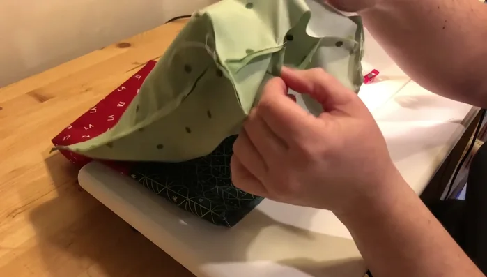 Insert lining: Place the outer bag inside the lining, right sides together. Match up side seams, and sew around the top with a 1/4" seam allowance.