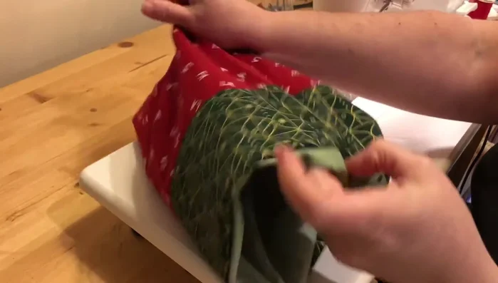 Press and sew drawstring channels: Press the top edge of the bag. Using a sewing machine, sew two parallel lines 1" apart to create the drawstring channels.